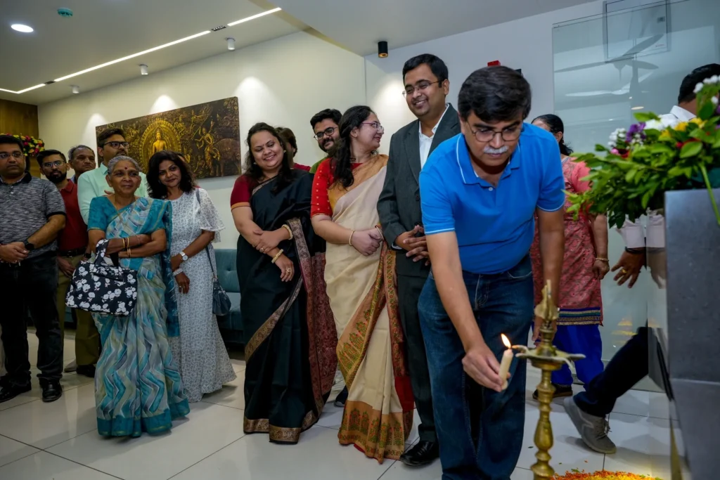 Guests at the Rheumatology Clinic opening gathered as a traditional oil lamp is lit
